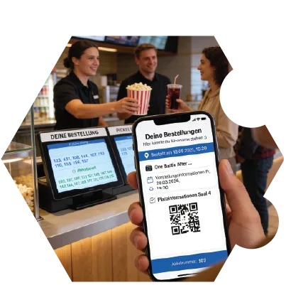 Kinopersonal bearbeitet eine mobile Gastbestellung am Concession-Stand